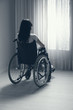 Photo: Sad woman sitting on wheelchair Sad woman sitting on wheelchair