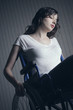 Foto: Sad woman sitting on wheelchair Sad woman sitting on wheelchair