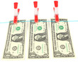 One dollar bills hanging on rope