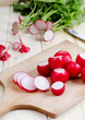 Fresh radishes on a wooden cutting board