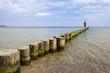Fotograf auf den Buhnen am Ostseestrand