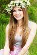 beautiful girl in wreath of flowers
