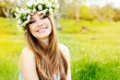 beautiful girl in wreath of flowers