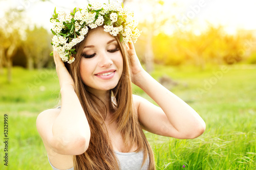 Photo: beautiful girl in wreath of flowers beautiful girl in wreath of flowers