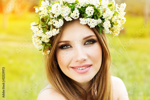 Photo: beautiful girl in wreath of flowers beautiful girl in wreath of flowers