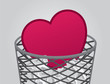 Heart inside garbage can with trash