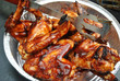 Barbeque Wings in a Tin with Tongs
