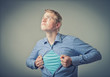 Businessman showing a superhero suit underneath his suit