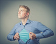 Businessman showing a superhero suit underneath his suit