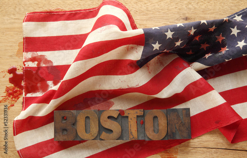 Photo: Boston word on a bloodied American flag Boston word on a bloodied American flag