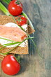 Bread with salmon, cream cheese and green onions.