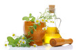 Photo: Fresh herbs in wooden mortar with pestlerosemary oil Fresh herbs in wooden mortar with pestlerosemary oil