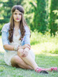 teen girl near lake in the park.