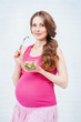 Pregnant woman with a salad