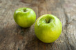 Photo: Green apples on wood table Green apples on wood table