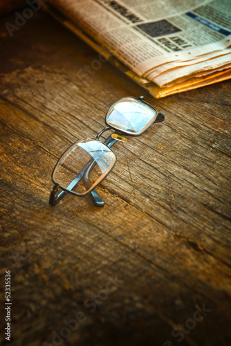 Photo: Rading glasses and newspaper Rading glasses and newspaper