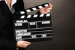 Photo: Movie production clapper board isolated on black Movie production clapper board isolated on black