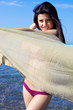 Amazing beautiful woman relaxing smiling on the beach
