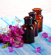 Spa oil and freesia on light background