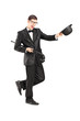 Full length portrait of cheerful young man in a bow tie suit and