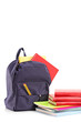 Studio shot of a school backpack with books and notebooks