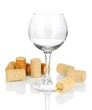 Wineglass and corks isolated on white
