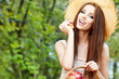 Beautiful woman in the garden with apples
