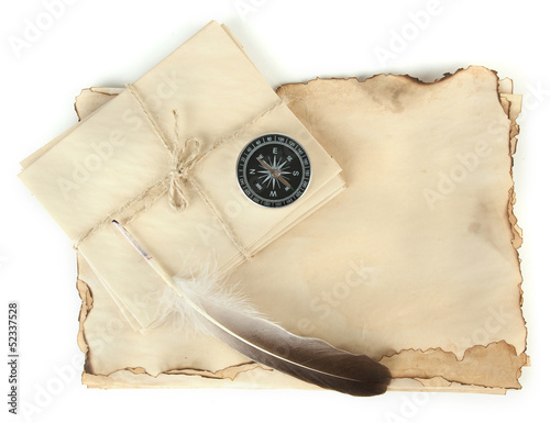 Photo: Old paper, letters and compass isolated on white Old paper, letters and compass isolated on white