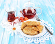 Sweet baklava on plate with tea on table