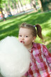 girl eating cotton candy