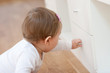 Baby opening a drawer