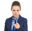 Concerned business woman pointing in camera