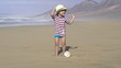 Boy with beautiful seashell on the beach, super slow motion