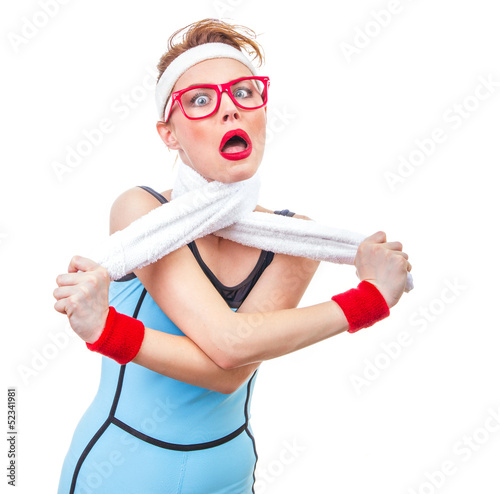 Photo: Funny fitness woman playing with her towel, humorous girl Funny fitness woman playing with her towel, humorous girl