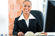 Photo: Lawyer in office with law book and computer Lawyer in office with law book and computer