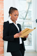 Photo: Lawyer or business woman in office with dossier Lawyer or business woman in office with dossier