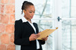 Photo: Lawyer or business woman in office with dossier Lawyer or business woman in office with dossier