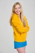 Portrait of smiling teenager girl isolated on grey background