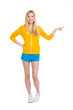 Foto: Full length portrait of teenager girl pointing on copy space Full length portrait of teenager girl pointing on copy space
