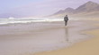 Businessman jogging on the beach, super slow motion, shot at 240