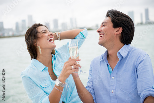 Photo: Romantic couple drinking champagne Romantic couple drinking champagne