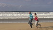 Couple jogging on the beach, super slow motion, shot at 240fps