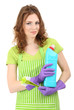 Young woman wearing rubber gloves with cleaning supplies,