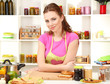 Young woman cooking in kitchen