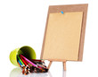 Small easel with sheet of paper with art supplies isolated