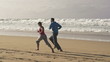 Couple jogging on the beach, super slow motion, shot at 240fps