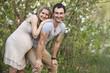 Photo: Young pregnant couple outdoors in spring Young pregnant couple outdoors in spring