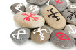 Fortune telling  with symbols on stones isolated on white