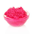 Horseradish sauce with beet in glass bowl, isolated on white