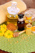 Fragrant honey spa with oils and honey on wooden table close-up